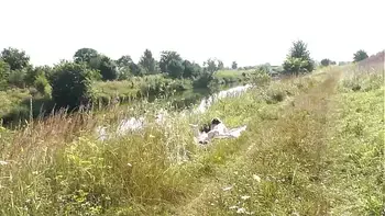 A casual passerby young guy saw a naked Milf sunbathing on river bank. Peeping. Spy camera. Naked in public. Nude beach. Wild beach