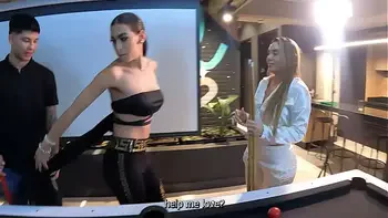 A threesome with two fiery Latinas on a pool table.