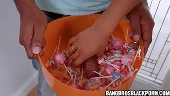Black girl dressed with a nurse costume collecting more than just candies at this house...