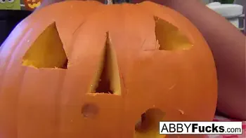 Abigail carves a pumpkin then plays with herself