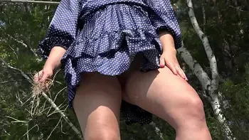 No panties outdoors in a public park. Big gorgeous ass and hairy pussy under a short skirt. Watching for curvy MILF in nature. PAWG. Amateur fetish.