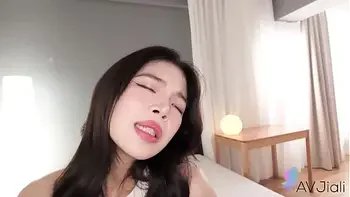 Chinese girl Mia with big tits enjoys sex.