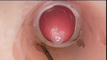 The camera in the deep pussy records a huge ejaculation of sperm into the condom