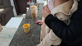 A stepdaughter is surprised while having breakfast.