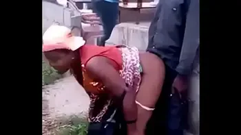 African woman fucks her man in public