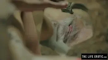 Horny milf shaves and squirts to orgasm while held in a basement