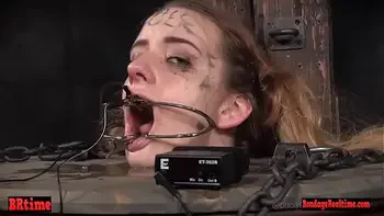 Bdsm babe trapped in a barrel and electrified