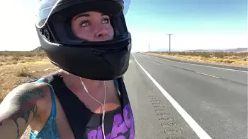 felicity feline riding on aprilia tuono motorcycle