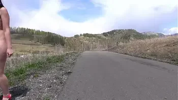 Outdoor exhibitionism. A completely naked babe with a sexy figure, juicy PAWG, and hairy pussy walks in high-heeled sandals on the road. Amateur fetish.