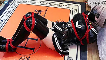 woman tied by red rope