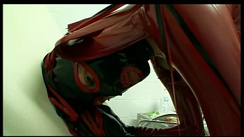 Humiliating pussy distress dildo sucking in masked, dominantrice in red latex dress