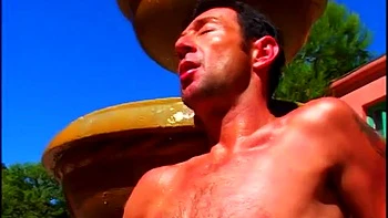 Muscle boys fucking next to a fountain
