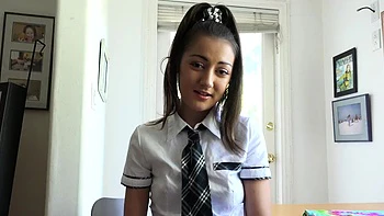 Kinky schoolgirl Lily Adams jerking off a cock with her feet