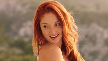 Redhead beauty Red Fox enjoys passionate sex with Erik Everhard in the bedroom.