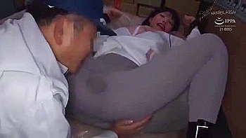 Her hands are tied, her big breasts are exposed, and her legs are spread as she is fingered.