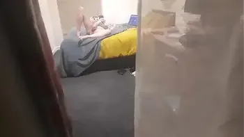 Girl caught masturbating through the window