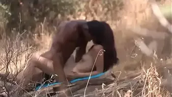 Black dude looks for horny babes at the nude beach and bangs one of 'em