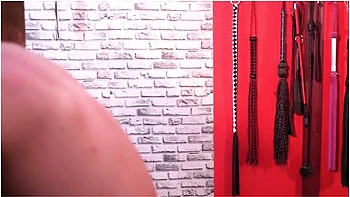 Bdsm. Dominatrix Whipped A Slave Who Is In Shackles