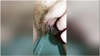 Bushy Pussy Girl Peeing In The Toilet With A Sanitary Pad In Her Panties