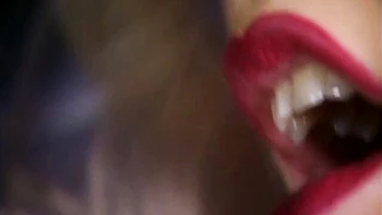 Angel with sexy red lips Kitty Sixx gets her face covered in cum