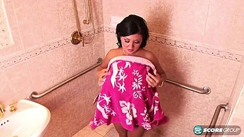 Big-boobed lady Daylene Rio takes a hot shower and wipes her tits