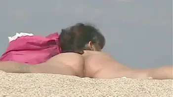 Exhibitionist Wife 23 - Lana is Filmed by her husband at the NUDE BEACH teasing a VOYEUR and showing off her ASSHOLE, MEATY PUSSY AND CLIT  in PUBLIC!!!