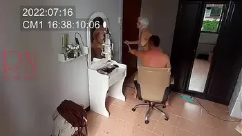 Nudist barbershop. Nude lady hairdresser in an apron makes client to strip. Security camera. The client is surprised. real spy cam 1