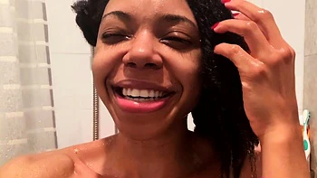 Ebony babe with big tits takes shower solo