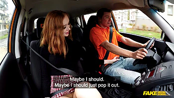 Redhead Distracts with no bra